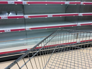 Empty supermarket shelves during panic buying in UK - March 2020
